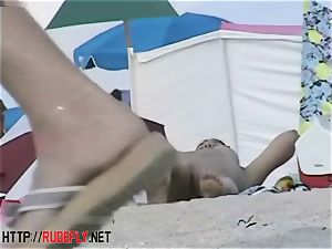 Beach sweeties dangle out naked below the sun