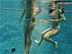 two stellar amateurs displaying their bodies off under water